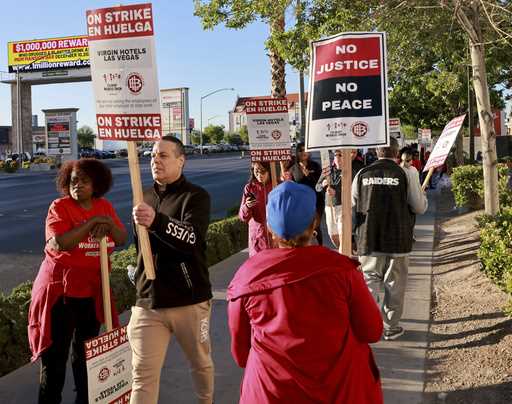 Culinary Local 226 members picket at the start of a 48 hour strike at Virgin Hotels in Las Vegas, F…