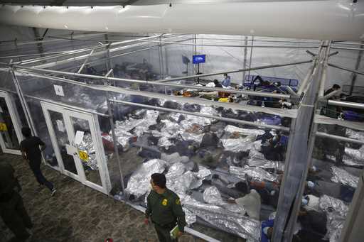 Children lie inside a pod at the main detention center for unaccompanied children in the Rio Grande…
