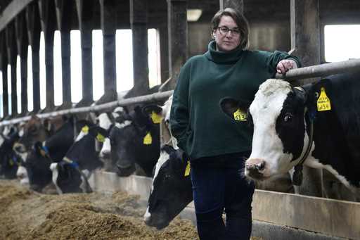 Jenni Tilton-Flood poses for a photograph in a dairy barn at Flood Brothers Farm, Wednesday, March …