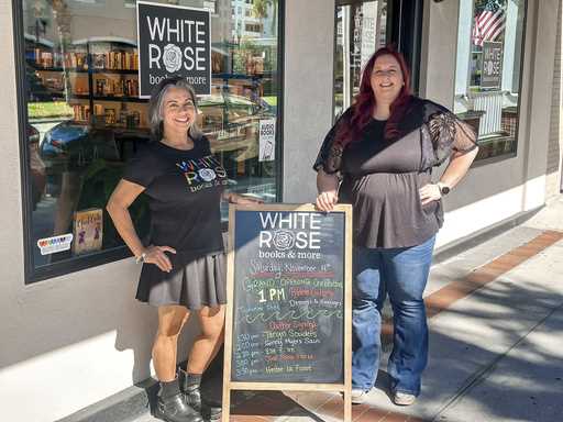 This image released by White Rose Books & More shows bookstore owners Tania Galiñanes, left, and Er…