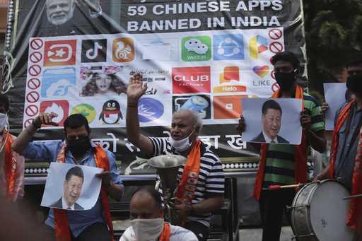 FILE- Activists of Jammu and Kashmir Dogra Front shout slogans against Chinese President Xi Jinping…