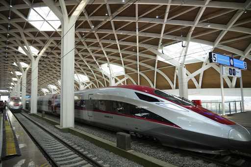 High-speed train is parked during the opening ceremony for launching Southeast Asia's first high-sp…