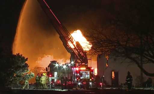 In this frame grab taken from video provided by WXYZ, firefighters battle an industrial fire in the…