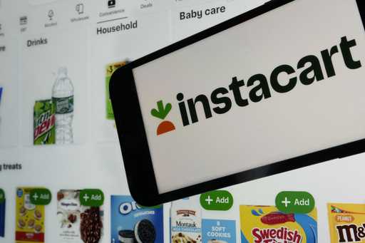 An instacart logo and an instacart webpage are shown in this photo, in New York, Wednesday, Sept