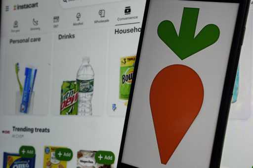 An instacart logo and an instacart webpage are shown in this photo, in New York, Wednesday, Sept