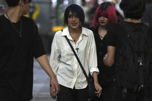 Iranian women walk in Tehran, Iran, Saturday, August 5, 2023