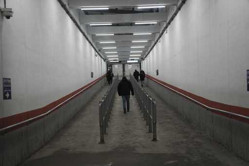 Palestinians cross into Israel through a checkpoint in Bethlehem, West Bank, on Wednesday, February…