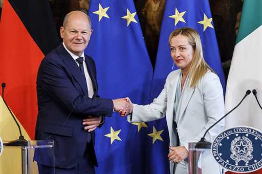 Prime Minister Giorgia Meloni shakes hands with the Chancellor of the Federal Republic of Germany O…