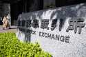 A person walks to Tokyo Stock Exchange building Thursday, April 27, 2023, in Tokyo