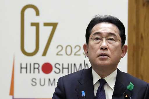 Japan's Prime Minister Fumio Kishida speaks during an interview with foreign media members at the P…