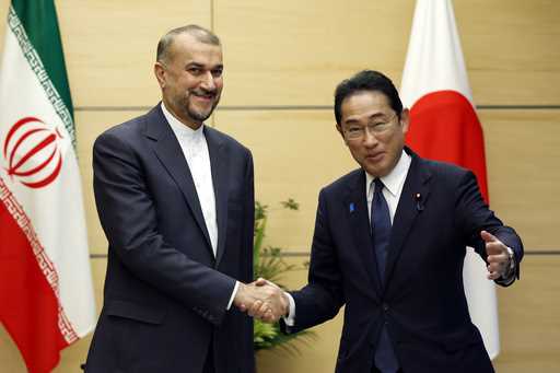 Iranian Foreign Minister Hossein Amir-Abdollahian, left, meets with Japanese Prime Minister Fumio K…