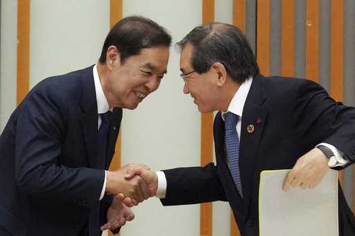 Masakazu Tokura, right, chairman of Keidanren, and Kim Byung-joon, left, acting chairman of the Kor…