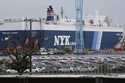 Cars for export park at a port in Yokohama, near Tokyo, on July 6, 2020