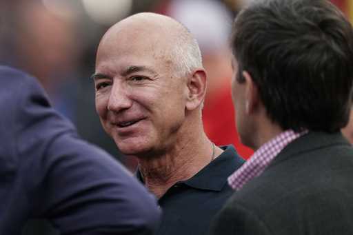 Amazon founder Jeff Bezos is seen on the sidelines before the start of an NFL football game, Sept