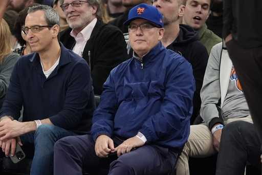 New York Mets owner Steve Cohen watches during the first half of an NBA basketball game between the…