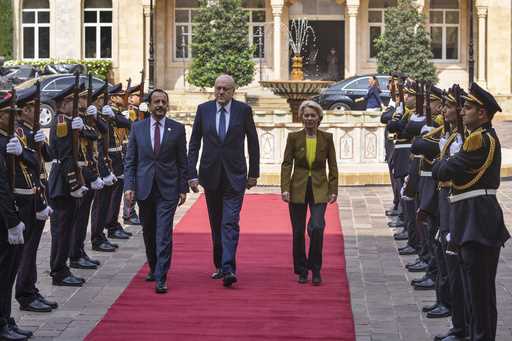 Lebanese caretaker Prime Minister Najib Mikati, center, welcomes Cyprus' President Nikos Christodou…