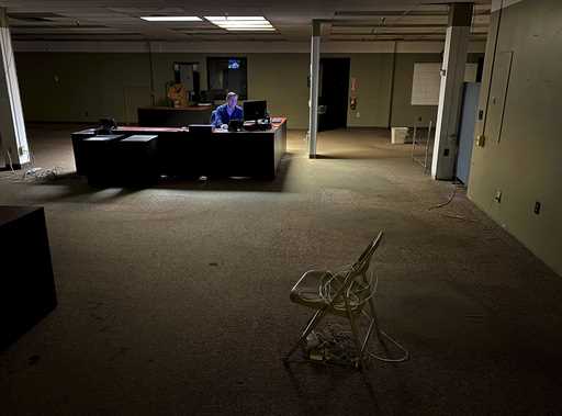 News Editor Chris Sciria puts the newspaper to bed for the last time from an empty newsroom at The …