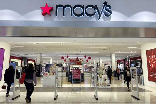 Shoppers enter a Macy's department store in Bay Shore, Long Island, New York, December 12, 2023