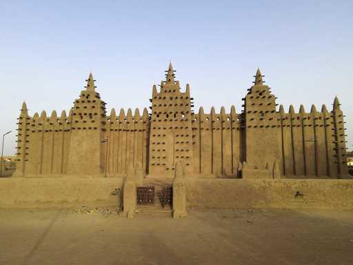 FILE- The world's largest mud-brick building, the Great Mosque of Djenne, Mali, awaits its annual r…