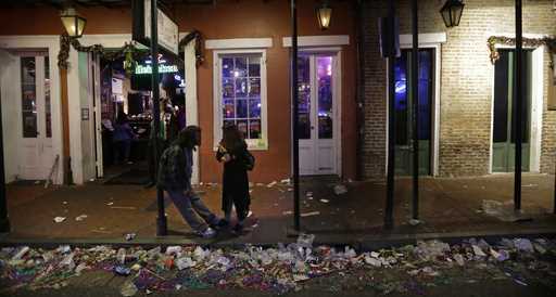 Trash lines the gutter on Bourbon Street, in the early hours of the morning after Mardi Gras, in Ne…