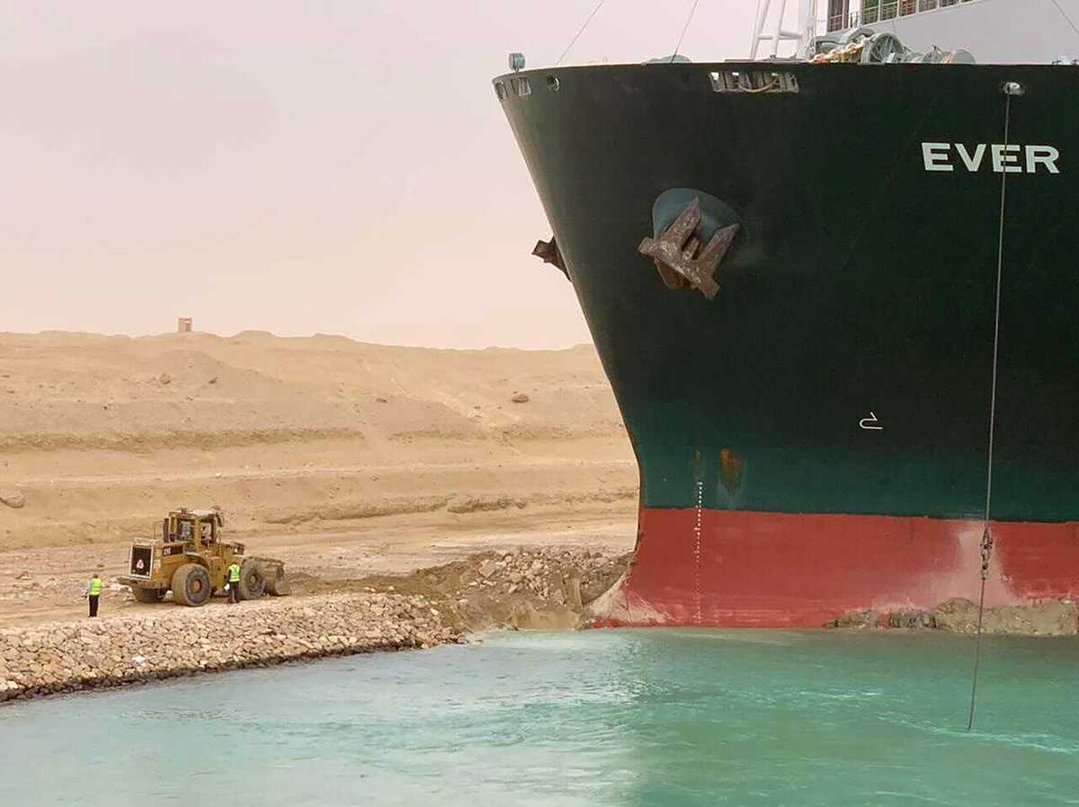 Massive cargo ship becomes wedged, blocks Egypt's Suez ...