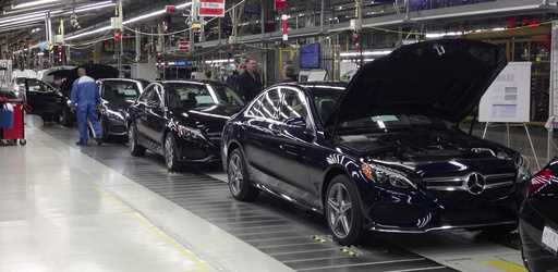 The redesigned Mercedes-Benz C-Class sedan reaches its final assembly stage the auto maker's plant,…
