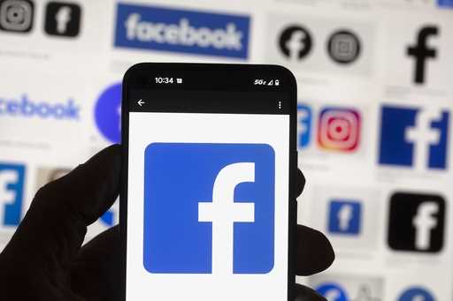 The Facebook logo is seen on a cell phone in Boston, USA, October 14, 2022