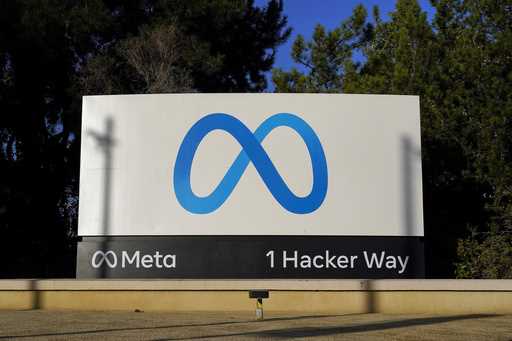 Meta's logo is seen on a sign, November 9, 2022, at the company's headquarters in Menlo Park, Calif…