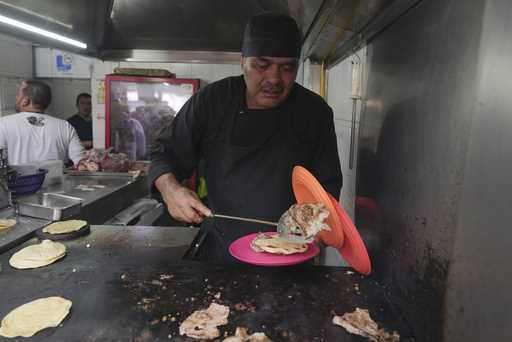Mexican chef Arturo Rivera Martínez, owner of Tacos El Califa de León, speaks with reporters in Mex…