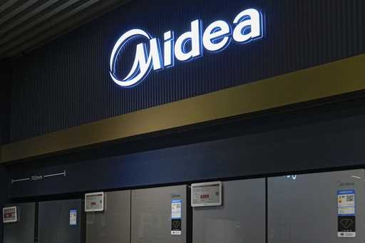 Midea's fridges are seen at an electronic shop in Beijing on November 15, 2021