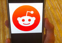This June 29, 2020 file photo shows the Reddit logo on a mobile device in New York