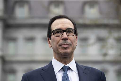Former Treasury Secretary Steve Mnuchin speaks with reporters at the White House, March 13, 2020, i…