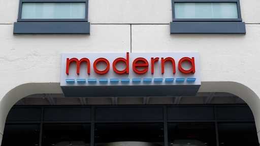 A sign marks an entrance to a Moderna building in Cambridge, Mass