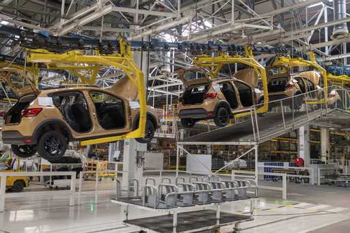 Cars are placed on a production line inside a Renault factory outside of Tangier, Morocco, Monday, …