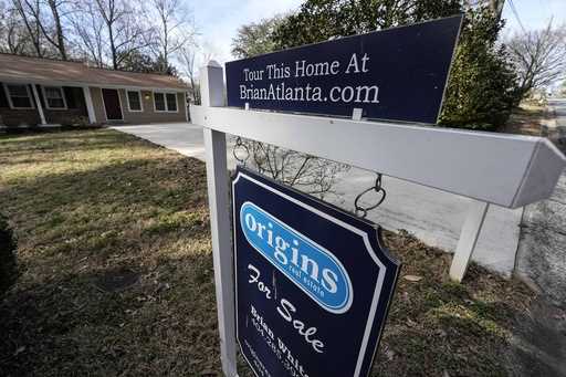 A sign announcing a home for sale is shown on February 1, 2024, in Kennesaw, Ga