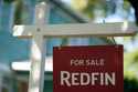 A "For Sale" sign is displayed outside a home on Friday, July 11, 2025, in Portland, Ore