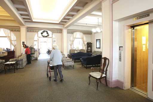 Bret Harte Retirement Inn residents make their way down to the dining room for lunch on May 6, 2020…
