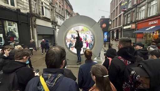 People view the live stream portal between Dublin and New York, in Dublin, Ireland, on Monday May 1…