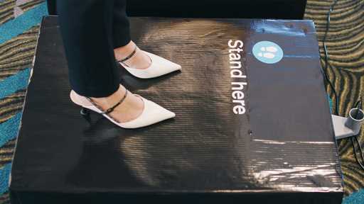 In this photo supplied by Air New Zealand, a woman stands on scales to be weighed ahead of a flight…