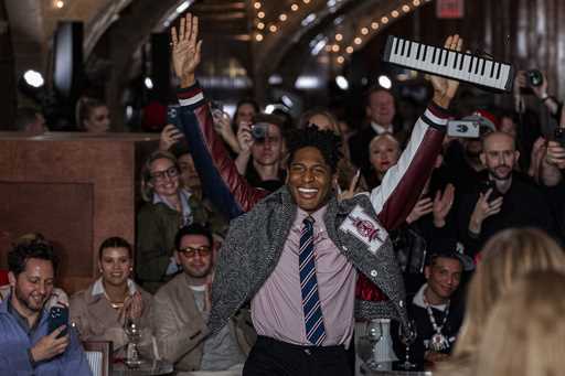 Musician Jon Batiste, center, performs at the Tommy Hilfiger runway show during Fashion Week, Frida…