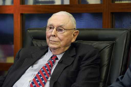 Berkshire Hathaway Vice Chairman Charlie Munger listens to a question during an interview on May 7,…