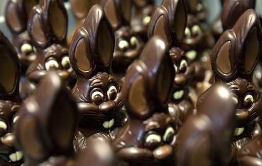 Chocolate rabbits wait to be decorated at the Cocoatree chocolate shop, April 8, 2020, in Lonzee, B…