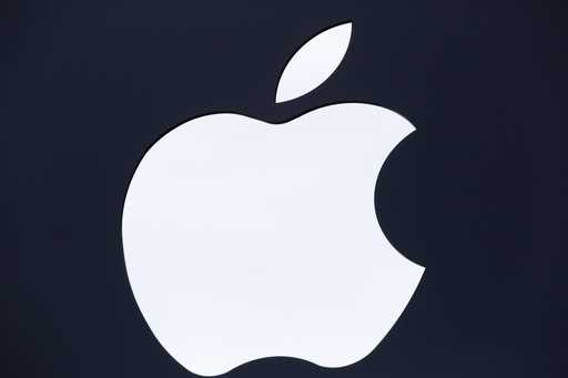 The Apple logo is shown on a sign hanging in front of a new Apple Store, Thursday, July 28, 2016, i…