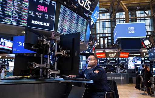 FILE = Traders work on the floor of the New York Stock Exchange Wednesday, March 20, 2024