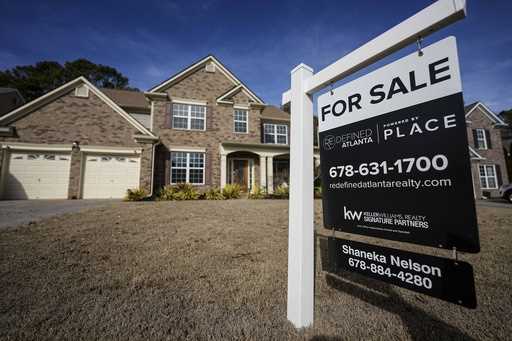 A sign announcing a home for sale is posted outside a home, February 1, 2024, in Aceworth, Ga