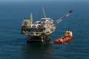 A rig and supply vessel are viewed in the Gulf of Mexico off the cost of Louisiana, April 10, 2011