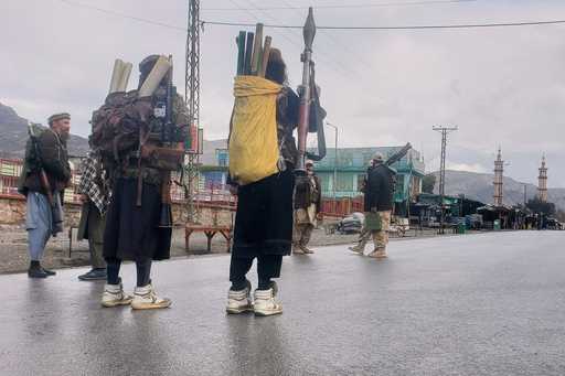 Taliban fighters stand near the closed Torkham border with Pakistan, where Pakistani and Afghan for…