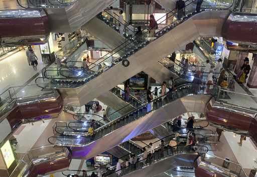 People go up and down the escalators