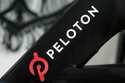 A Peloton logo is seen on the company's stationary bicycle on November 19, 2019, in San Francisco, …
