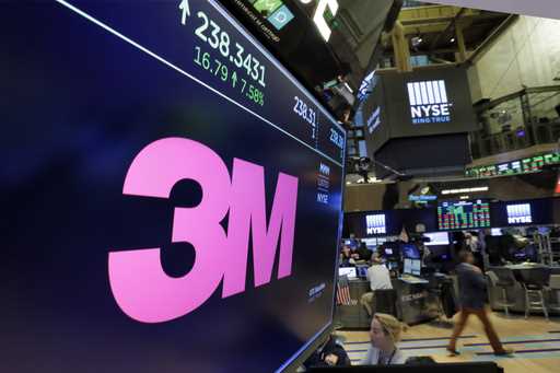 The logo for 3M appears on a screen above the trading floor of the New York Stock Exchange, October…